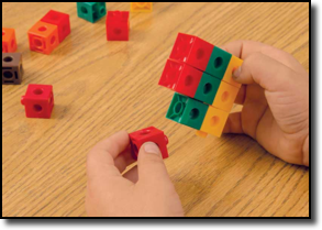 student building cubes